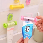 Dispositivo 2016 Hot Venda Nova rolamento tubo de creme dental Squeezer Banho Gadget sucção Hooks dentífrico