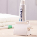 Rolando Tubo Squeezer criativa Holder Plastic assento para dentífrico Facial Tubo Cleanser Creme dental Squeezer Branco
